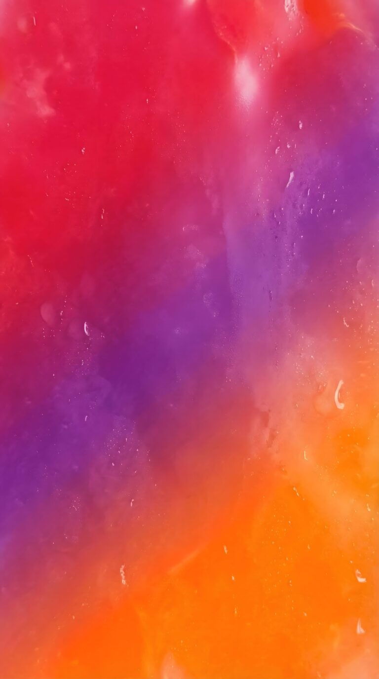 Vibrant digital texture featuring a red purple and orange fluid gradient blend aesthetic 4K ultra HD mobile wallpaper
