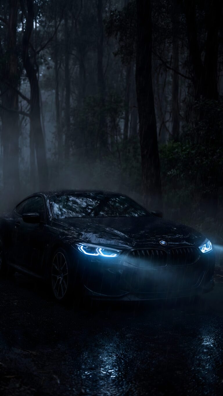 Highly detailed digital art of a stealth black BMW M8 sports car parked in a dark misty forest at night with glowing blue headlights aesthetic 4K ultra HD mobile wallpaper