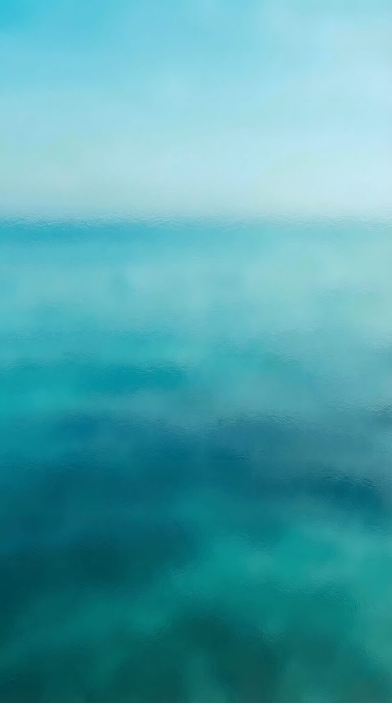 Aesthetic minimalist soft cyan and blue ocean horizon gradient with a dreamy sky 4K ultra HD mobile wallpaper