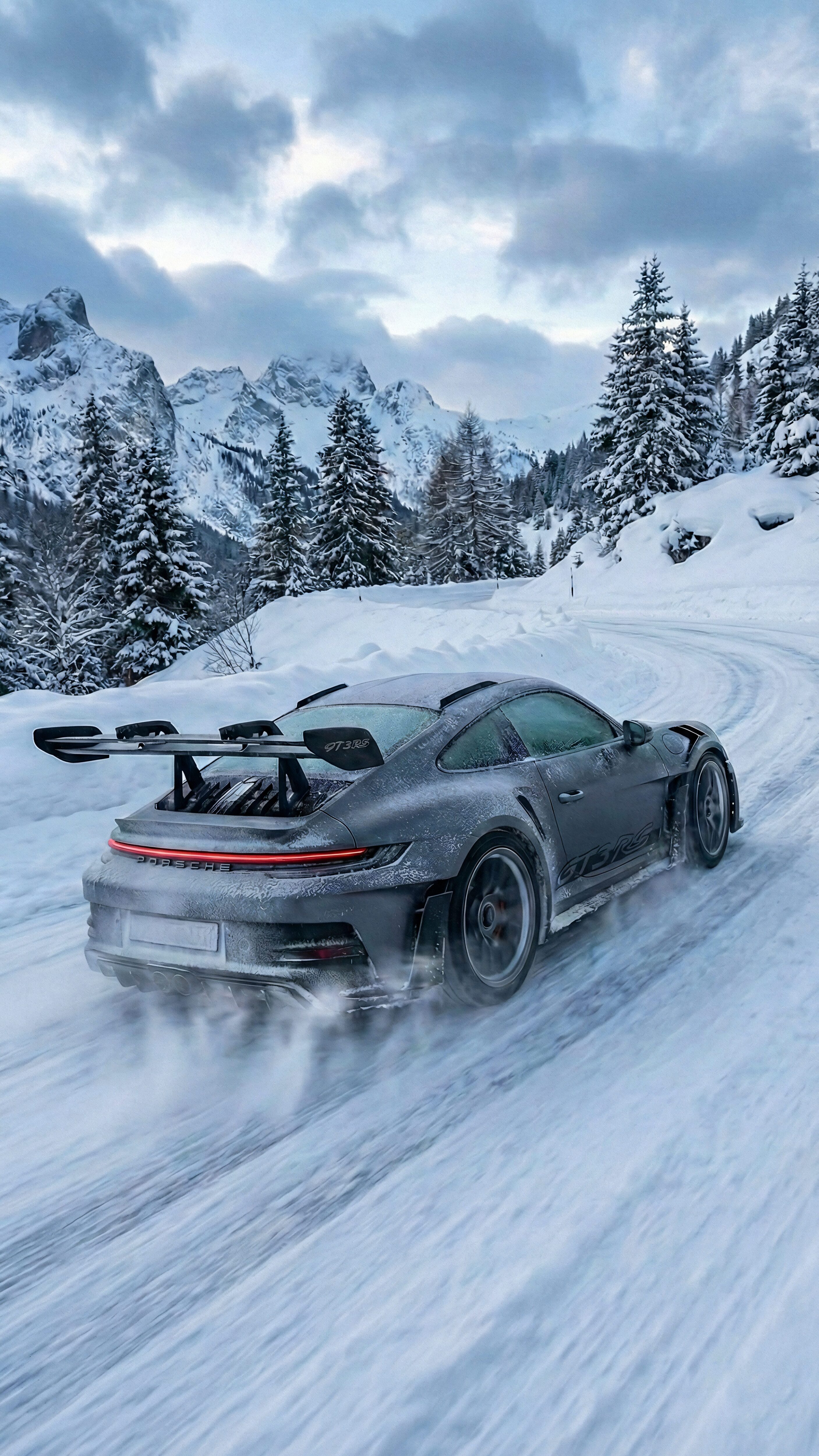Vertical cinematic photography of a grey Porsche 911 GT3 RS drifting on a snowy mountain road, kicking up snow from the tires, surrounded by frost-covered pine trees and majestic alpine peaks, 4K automotive wallpaper