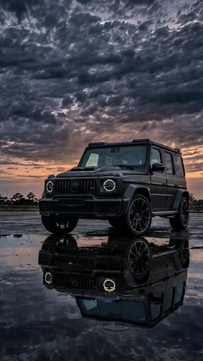 Highly detailed 4K wallpaper of a stealth black luxury G-Wagon SUV parked on a wet surface, showing a perfect mirror reflection under a dramatic and moody cloudy sunset sky.