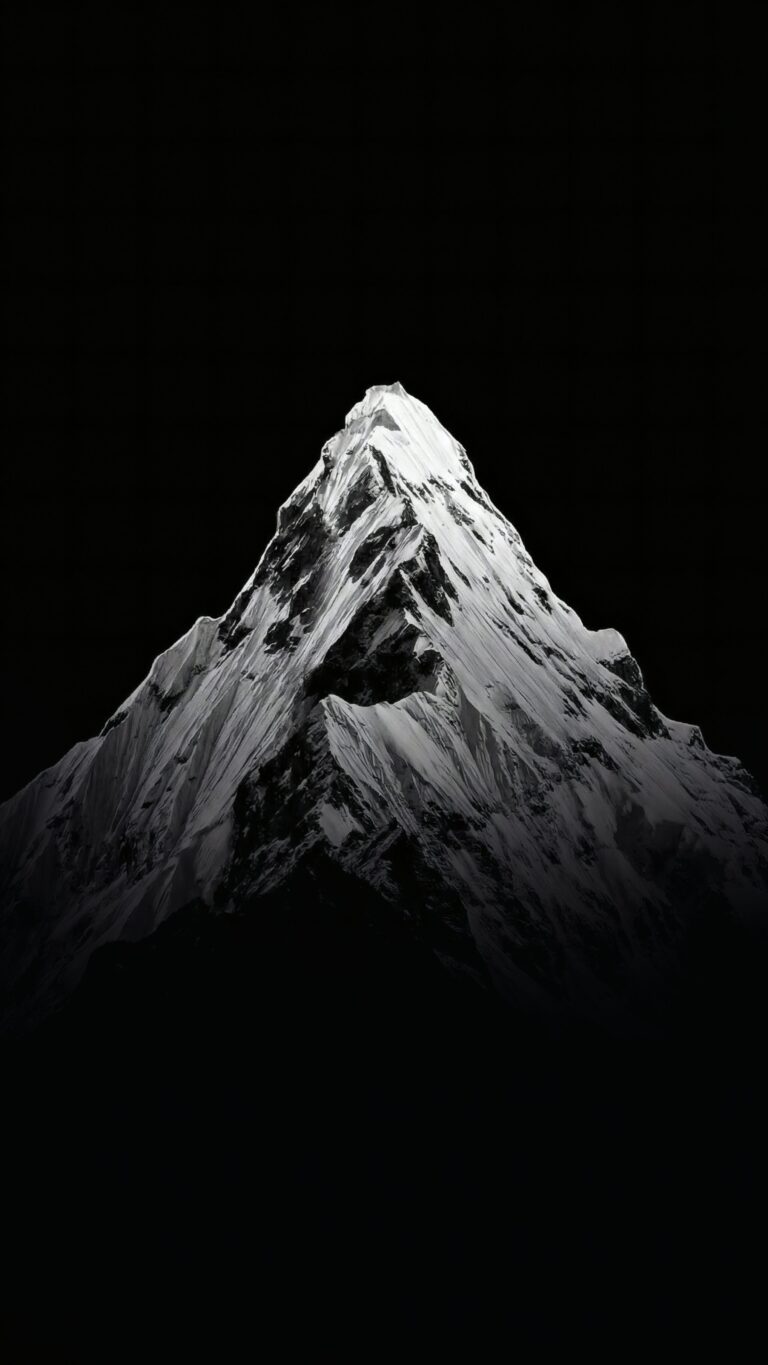 Download free 4K black and white mobile wallpaper of a sharp, snow-covered mountain peak against a solid black background, ideal for AMOLED screens.