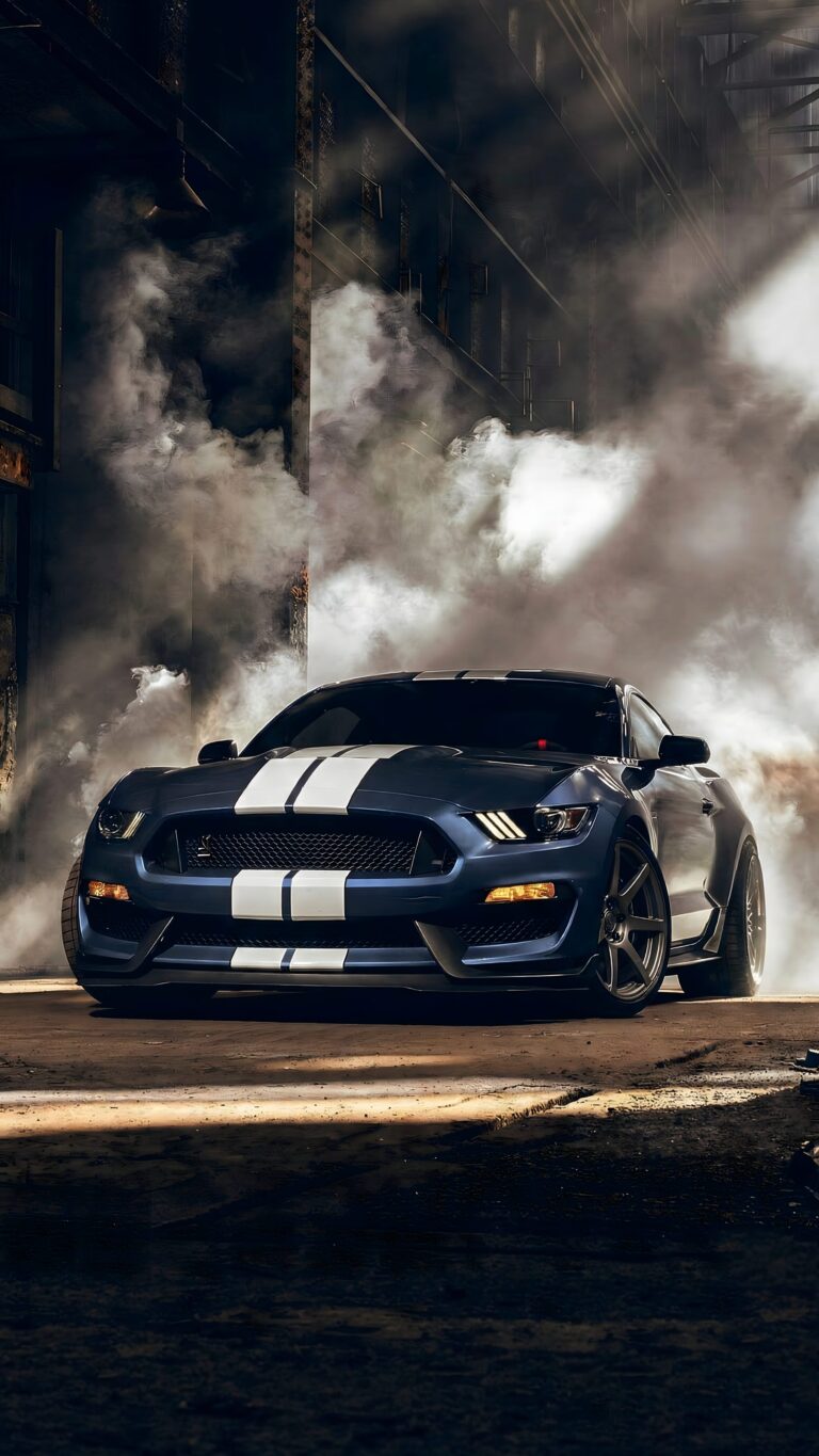 Highly detailed digital render of a dark blue Ford Mustang Shelby muscle car with white racing stripes parked in a dark cinematic smoky garage aesthetic 4K ultra HD mobile wallpaper