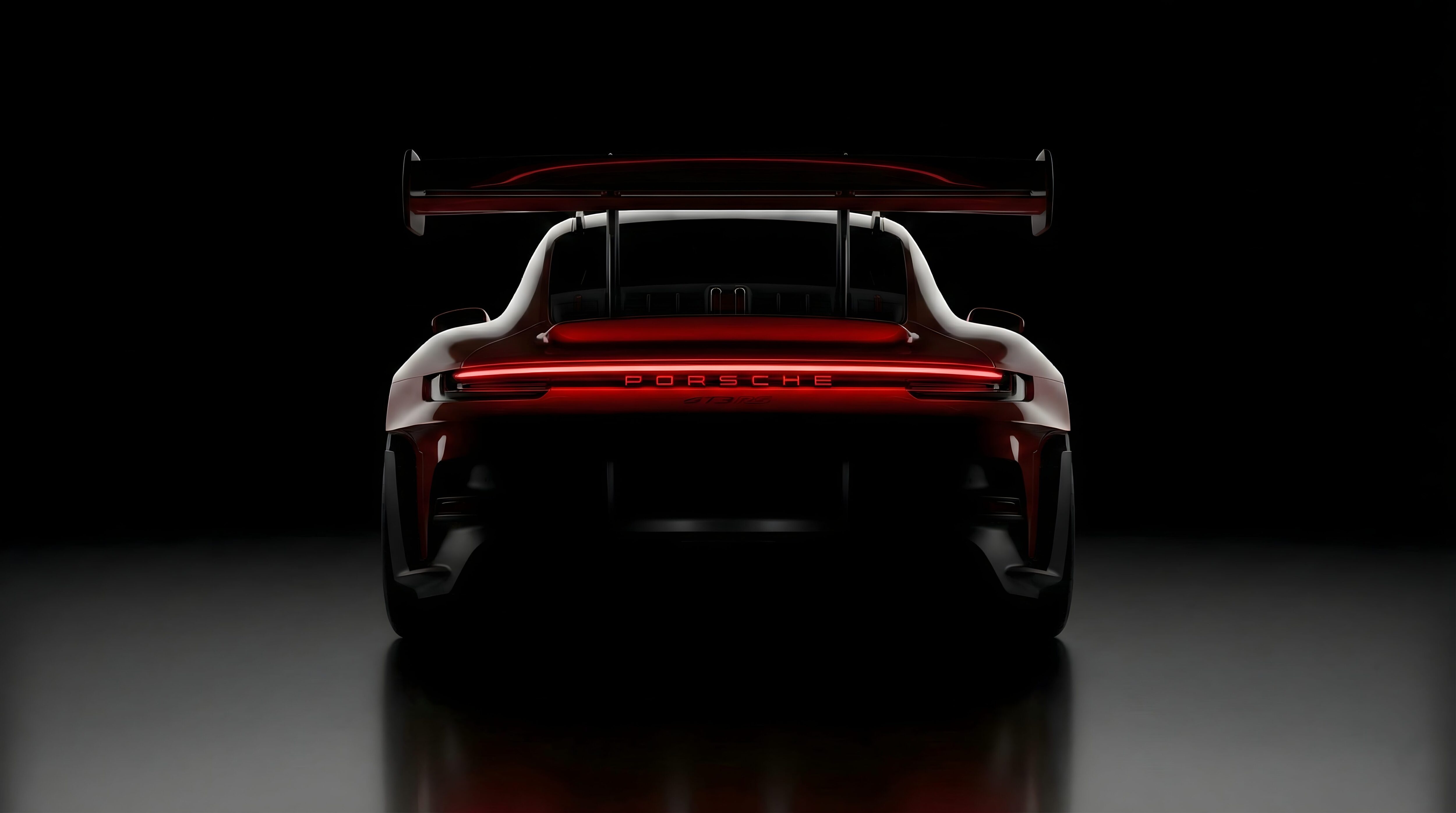 Dark Red Porsche GT3 RS AMOLED Wallpaper 4K, cinematic rear view of a dark red sports car with glowing red taillights and a massive rear wing on a pitch-black background.