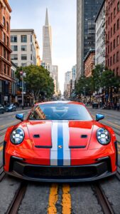 Highly detailed digital render of a vibrant red sports car with white and blue racing stripes parked on tram tracks in the middle of a bustling city street with tall skyscrapers urban cinematic aesthetic 4K ultra HD mobile wallpaper