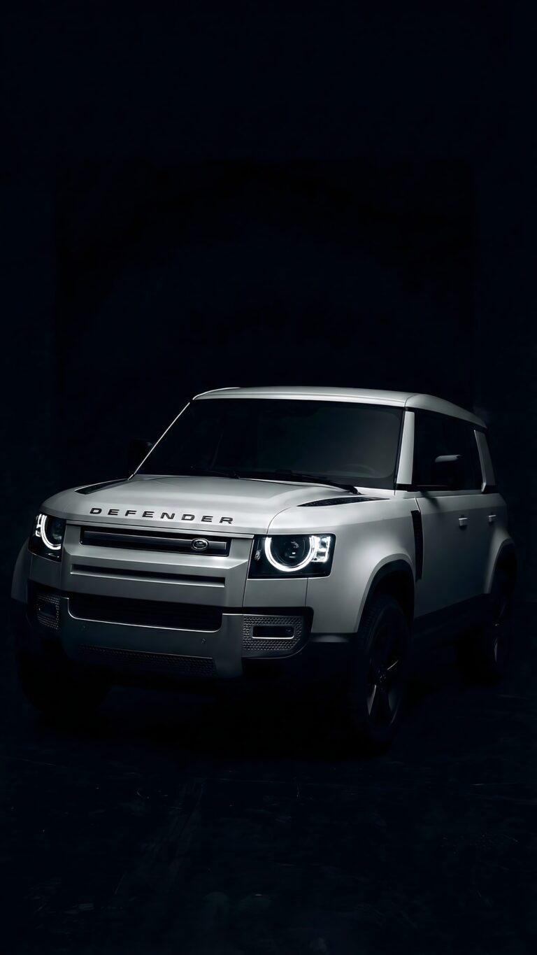 Highly detailed digital render of a pristine white Land Rover Defender luxury SUV with glowing circular LED headlights parked in a pitch black dark studio setting premium automotive aesthetic 4K ultra HD mobile wallpaper