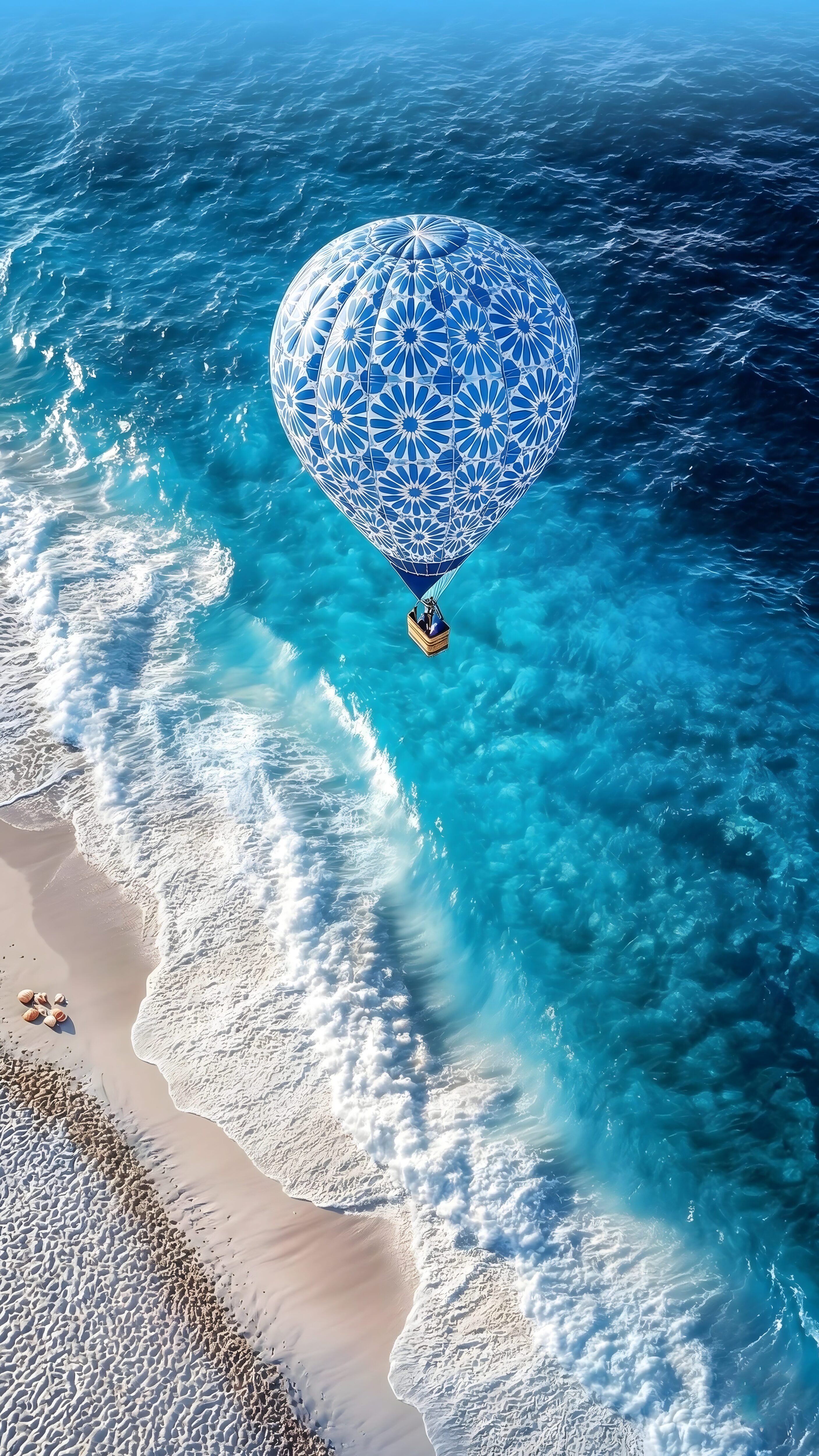 A high-resolution 4K mobile wallpaper of a blue and white patterned hot air balloon flying over clear turquoise ocean waves and a sandy beach.