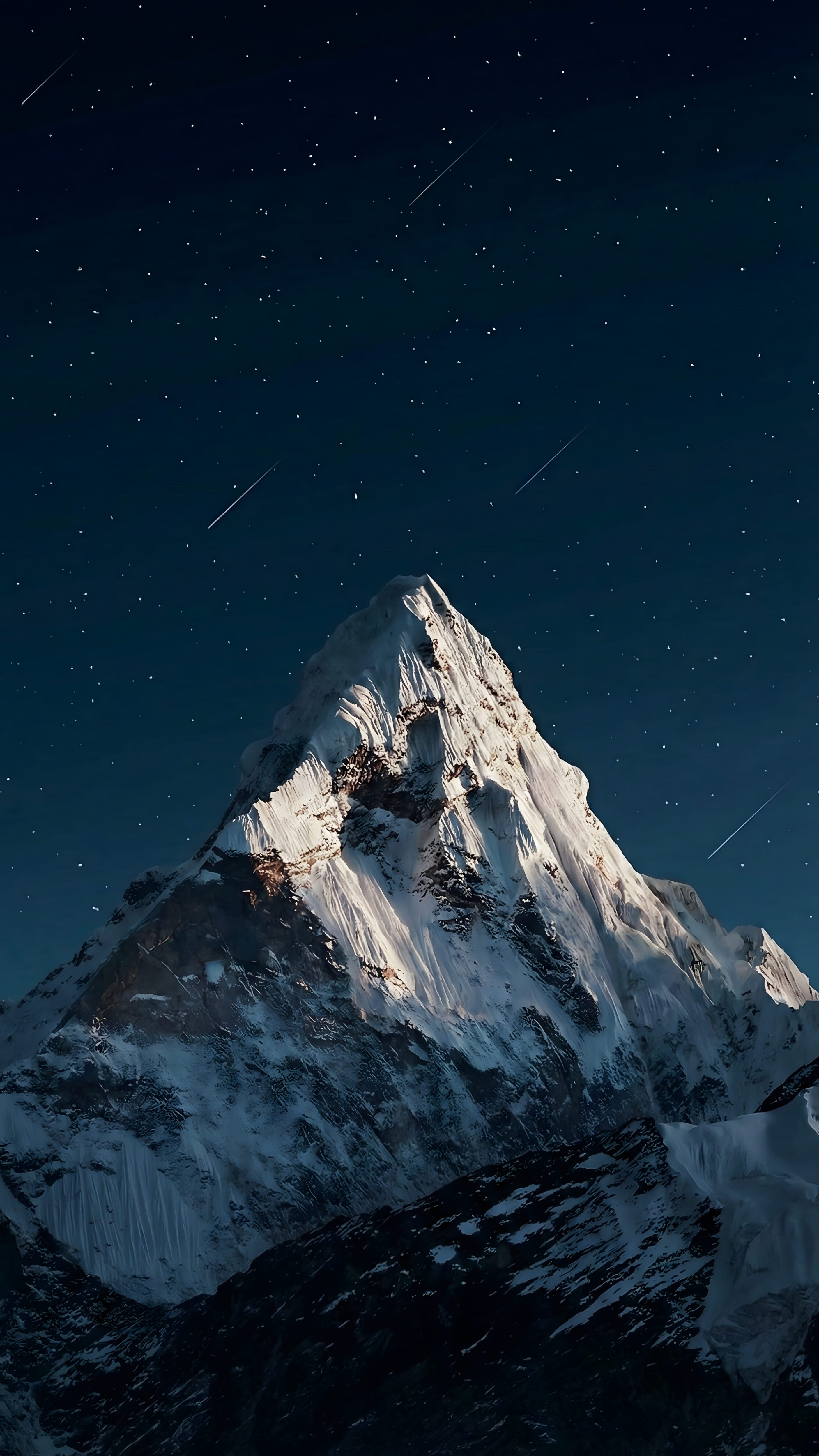 A high-resolution 4K mobile wallpaper featuring a sharp snow-capped mountain peak under a dark night sky filled with stars and shooting stars, designed for iOS depth effect.