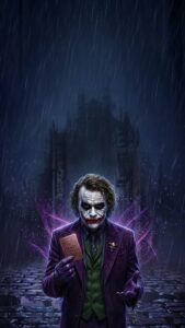 Joker Heath Ledger 4K mobile wallpaper holding a gold card in the rain with a dark Gotham City background.