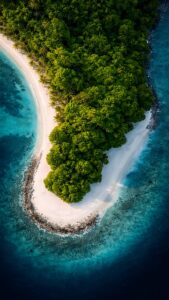 Crystal clear 4K iPhone wallpaper featuring an aerial view of a tropical island with a white sand beach and deep blue ocean water.