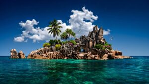A high-resolution 4K desktop wallpaper featuring a serene tropical island with unique granite rock formations, green palm trees, and crystal clear turquoise ocean water under a deep blue starry sky.
