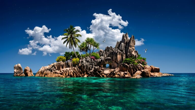 A high-resolution 4K desktop wallpaper featuring a serene tropical island with unique granite rock formations, green palm trees, and crystal clear turquoise ocean water under a deep blue starry sky.