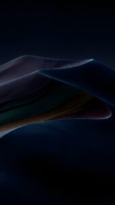 Abstract dark dunes at night with glowing edges and a subtle starry sky background.