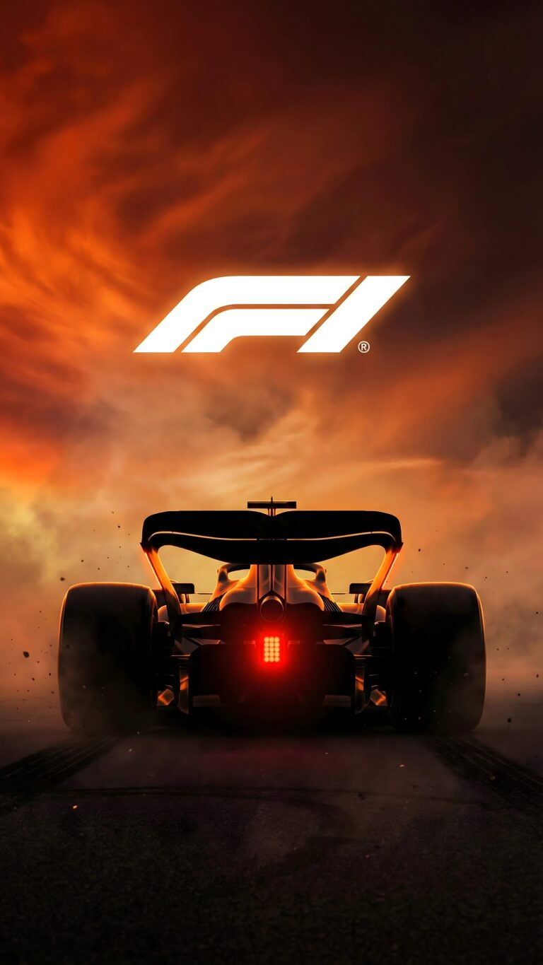 Rear view of a dark Formula 1 racing car on a track with a fiery orange cloudy sky, tire marks, and the white F1 logo floating above.