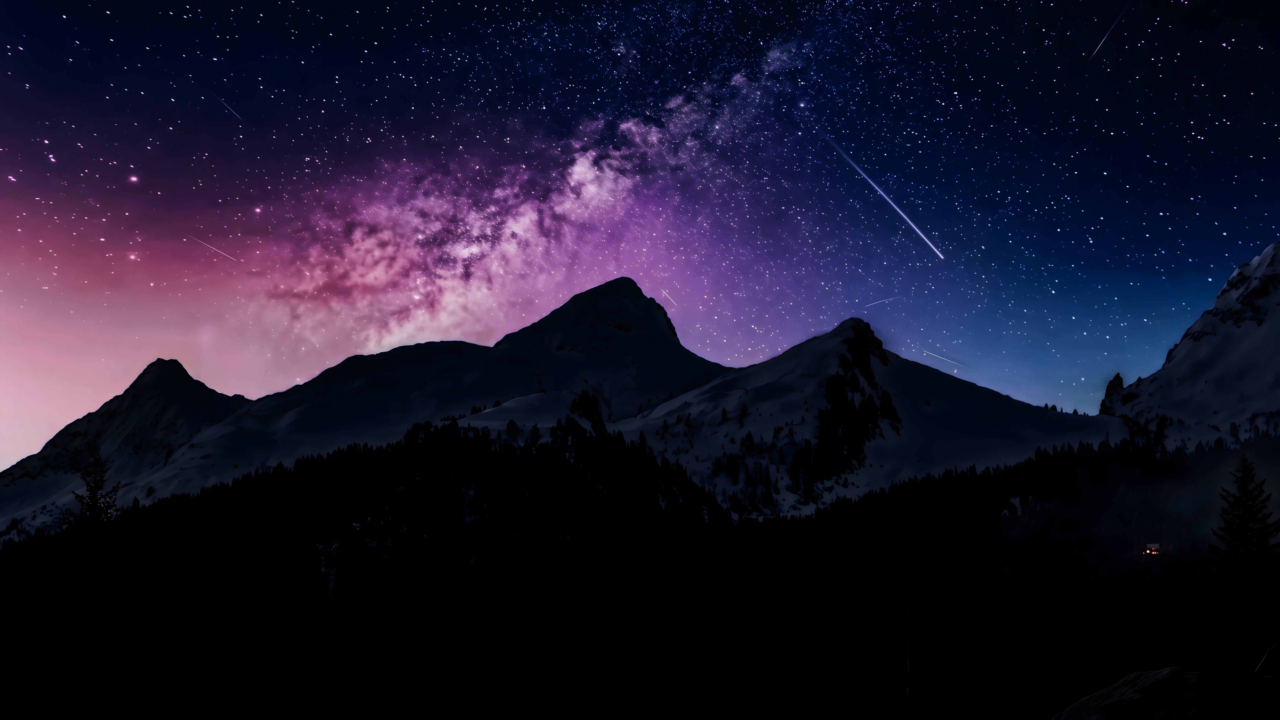 Silhouette of mountain peaks against a vibrant purple and blue night sky filled with stars, the Milky Way, and a shooting star.