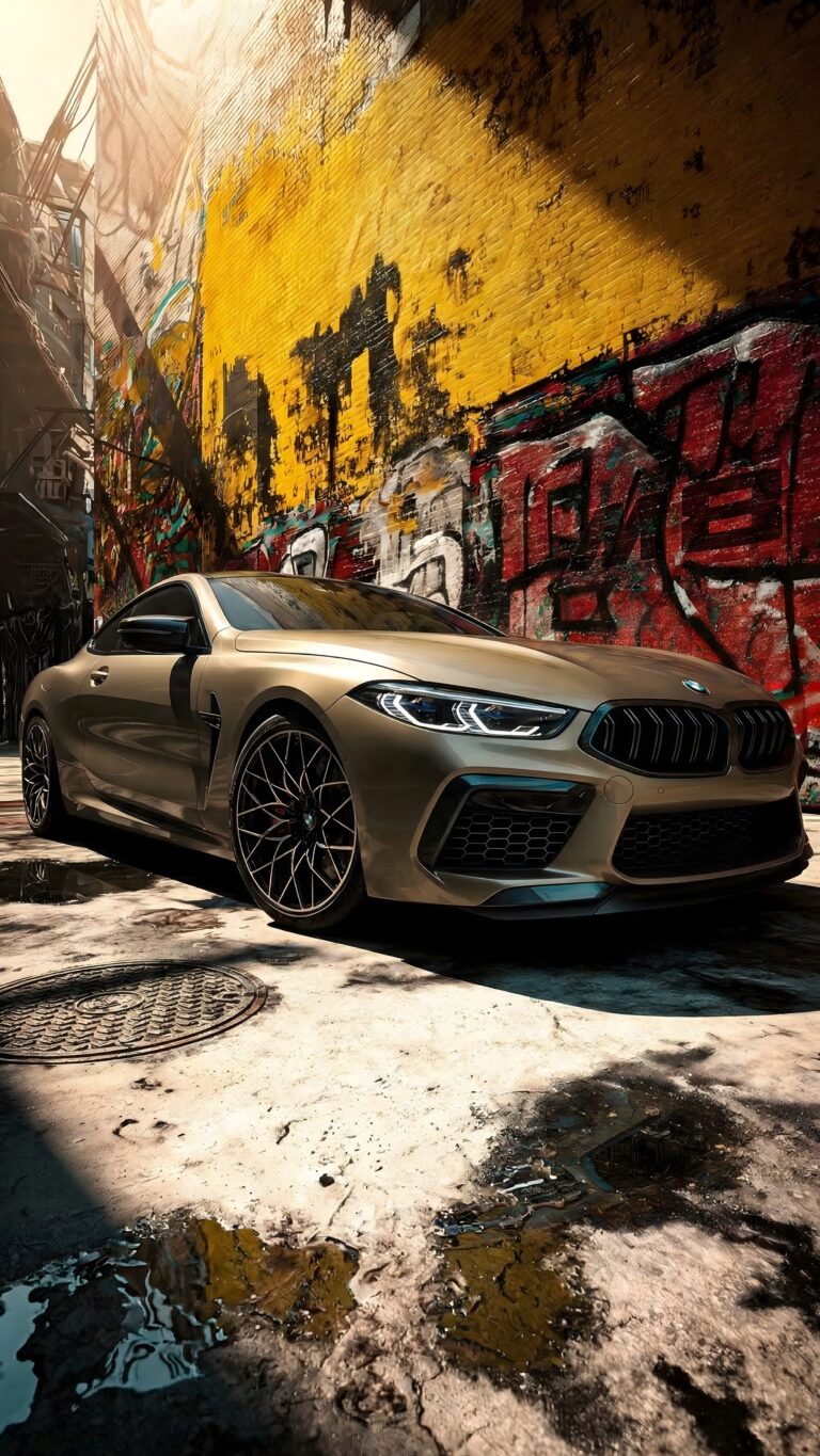 Golden BMW sports car parked in an urban alley with a vibrant graffiti wall, 4K resolution mobile wallpaper.