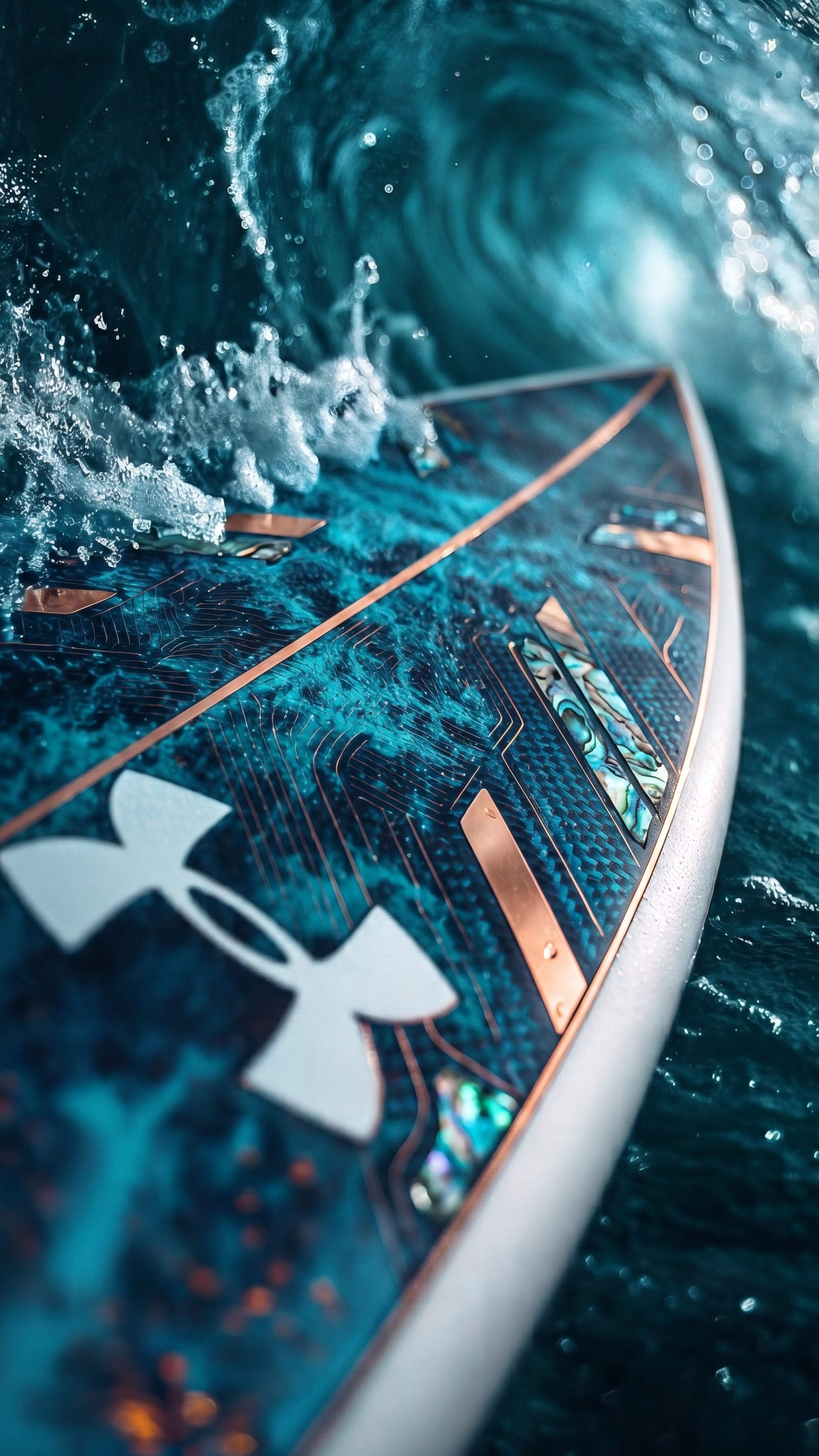 Close-up of a high-tech Under Armour surfboard with copper accents and abalone shell inlays crashing through a deep teal ocean wave.