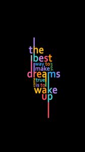 Colorful typography reading "the best way to make your dreams come true is to wake up" centered on a solid black background.