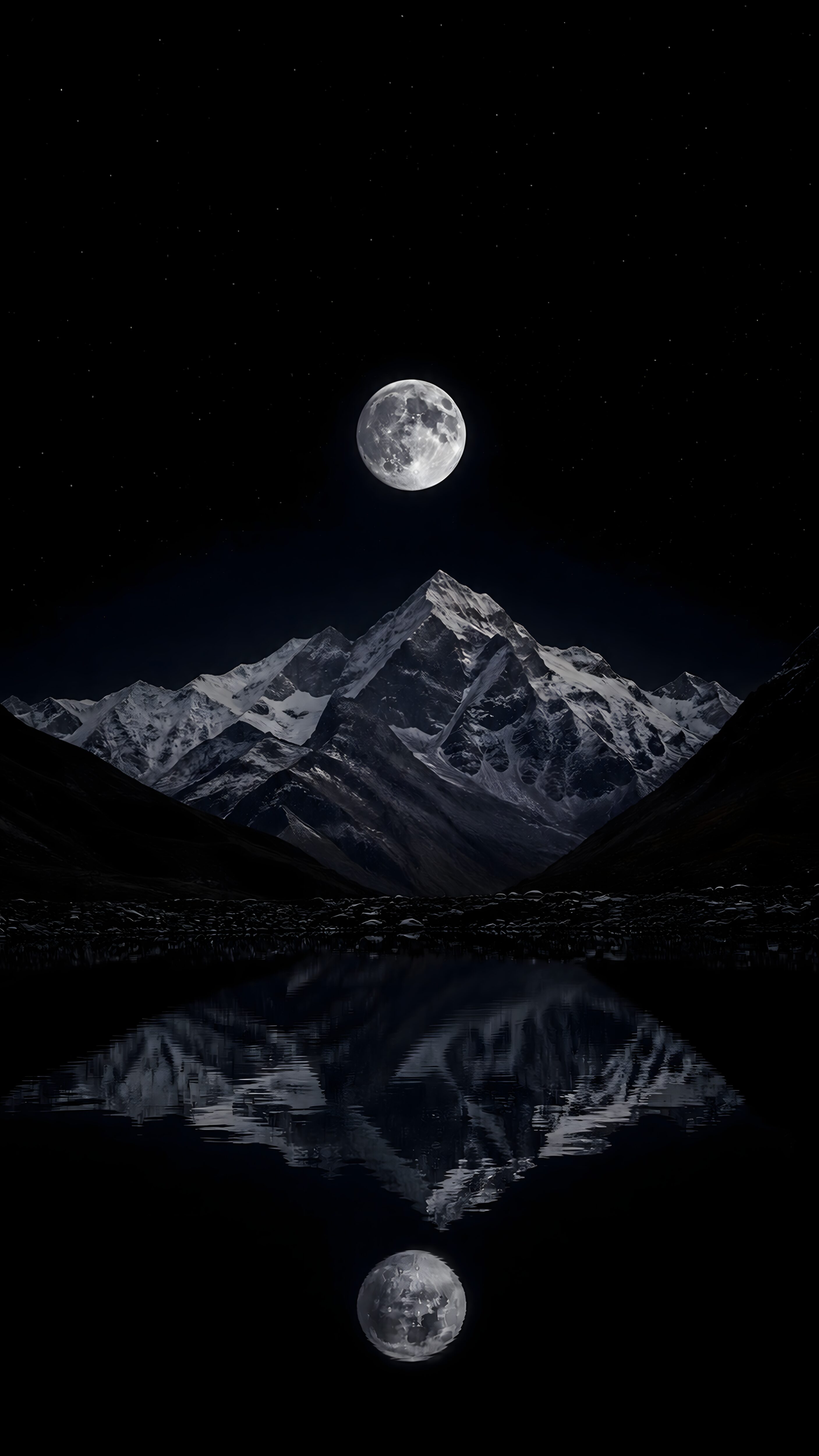 Full moon glowing over a snow-capped mountain ridge with a crisp water reflection against a pure dark night sky.